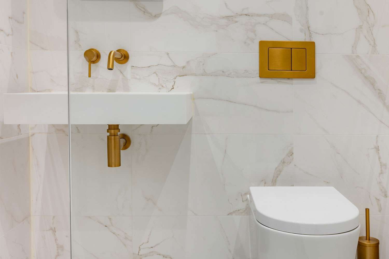 bathroom with large sink and large tiled walls